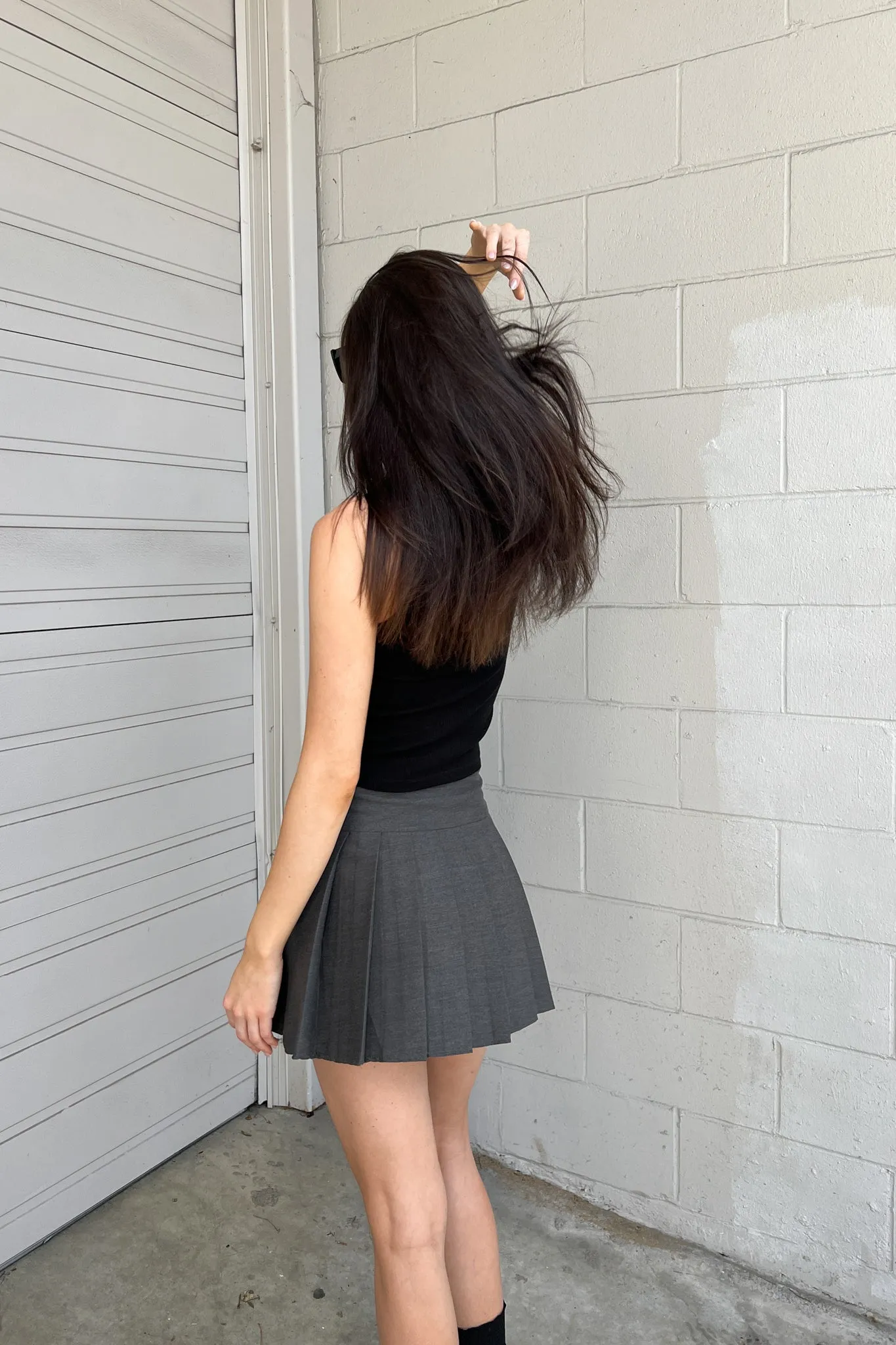 DOUBLE BELTED PLEATED MINI SKIRT