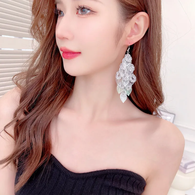 Exaggerated dress with long tassel hollow tree leaf earrings